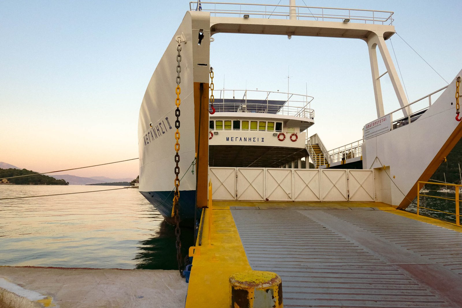 Meganisi II ferry with open loading ramp docked at sunset, Lefkada, Greece